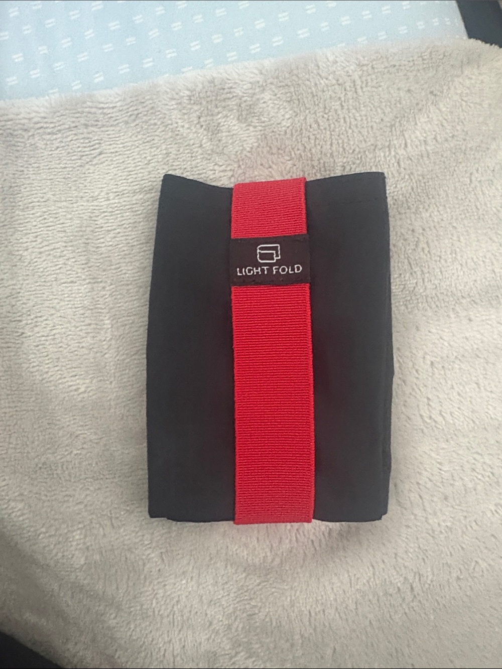 Light Fold Travel Packing Organizer in Black with Red Strap